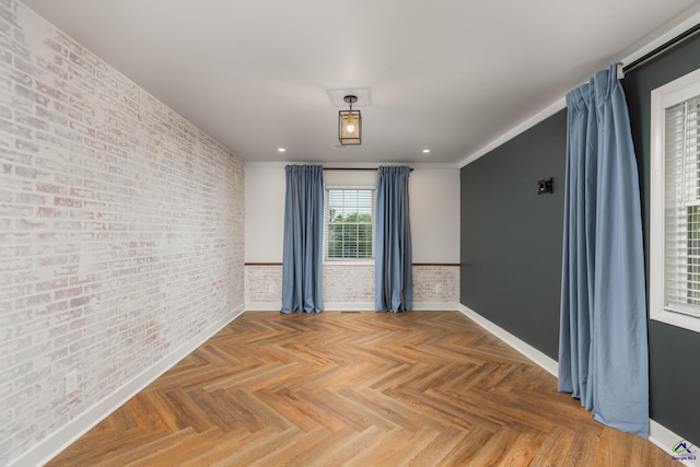 207 Oak Forest Ln, Warner Robins, GA 31088 - spare room featuring brick wall, recessed lighting, and baseboards