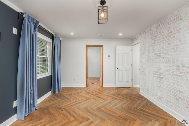 207 Oak Forest Ln, Warner Robins, GA 31088 - spare room featuring brick wall, baseboards, and recessed lighting