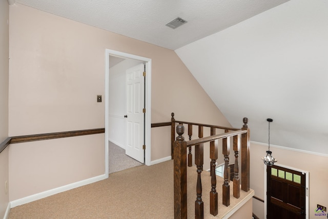 207 Oak Forest Ln, Warner Robins, GA 31088 - corridor featuring an upstairs landing, carpet flooring, baseboards, and lofted ceiling