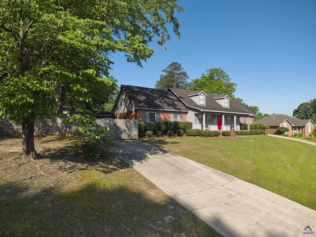 207 Oak Forest Ln, Warner Robins, GA 31088 - cape cod-style house with a porch and concrete driveway