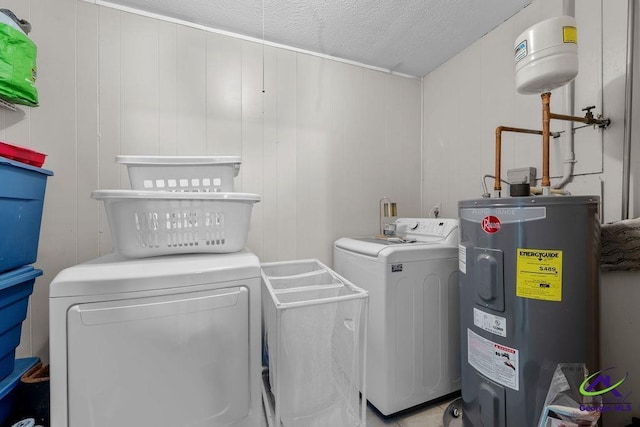 1322 Melford Dr, Columbus, GA 31907 - washroom with water heater, washer and dryer, and a textured ceiling