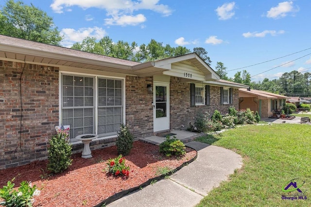 1322 Melford Dr, Columbus, GA 31907 - view of front of property featuring a front yard and brick siding