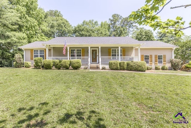 4407 Jones Rds, Macon, GA 31216 - single story home with a porch and a front lawn