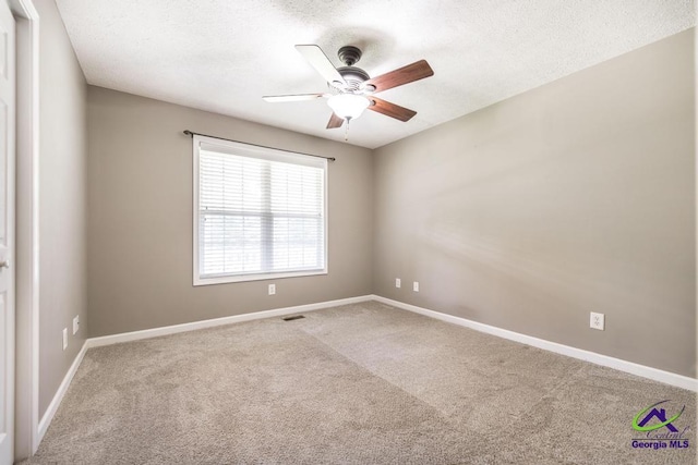 4407 Jones Rds, Macon, GA 31216 - carpeted empty room featuring a ceiling fan, a textured ceiling, and baseboards