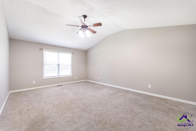 4407 Jones Rds, Macon, GA 31216 - empty room with ceiling fan, lofted ceiling, carpet, and baseboards