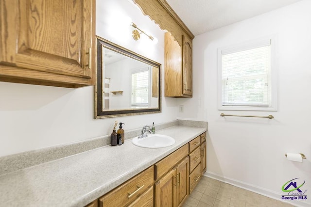 4407 Jones Rds, Macon, GA 31216 - bathroom with vanity, baseboards, and tile patterned flooring