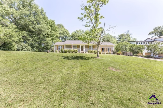 4407 Jones Rds, Macon, GA 31216 - ranch-style home with a front lawn