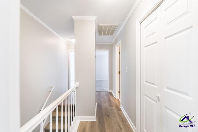 757 Silver Springs Drs, Macon, GA 31210 - hall featuring an upstairs landing, wood finished floors, ornamental molding, and baseboards