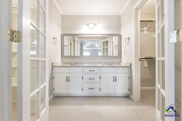757 Silver Springs Drs, Macon, GA 31210 - full bath with double vanity, a spacious closet, ornamental molding, baseboards, and french doors