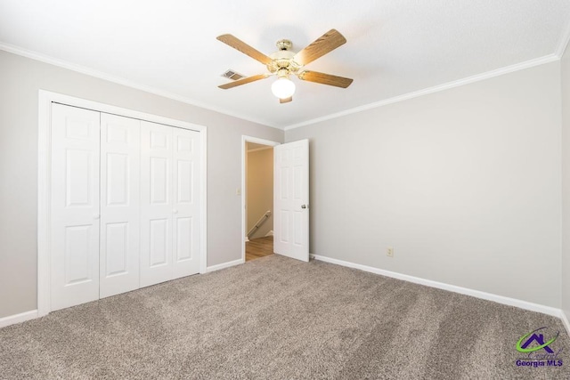 757 Silver Springs Drs, Macon, GA 31210 - unfurnished bedroom with ornamental molding, carpet floors, a closet, baseboards, and ceiling fan