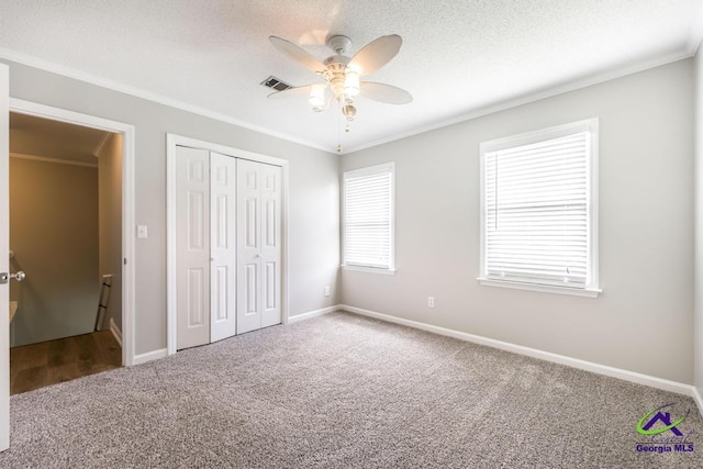 757 Silver Springs Drs, Macon, GA 31210 - unfurnished bedroom featuring carpet, ornamental molding, a closet, baseboards, and a ceiling fan