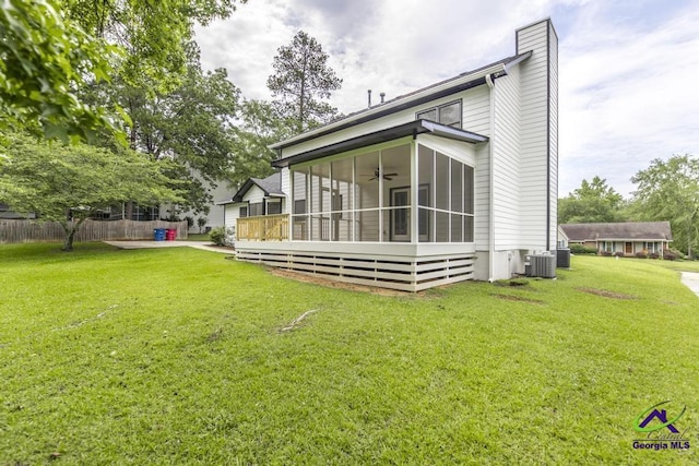 757 Silver Springs Drs, Macon, GA 31210 - rear view of house with a sunroom, a ceiling fan, cooling unit, and a chimney