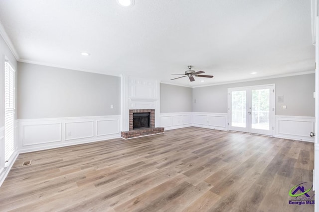 757 Silver Springs Drs, Macon, GA 31210 - unfurnished living room featuring ceiling fan, crown molding, recessed lighting, a decorative wall, and wainscoting