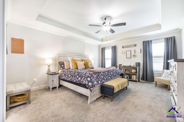 601 Hunts Landing Dr, Kathleen, GA 31047 - bedroom with ornamental molding, a tray ceiling, light colored carpet, a ceiling fan, and baseboards