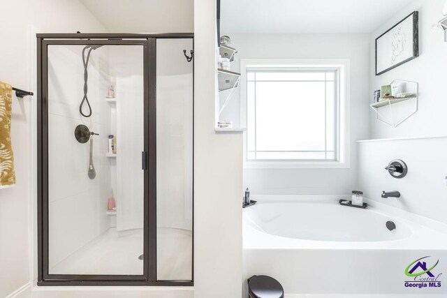 601 Hunts Landing Dr, Kathleen, GA 31047 - bathroom with a shower stall and a bath