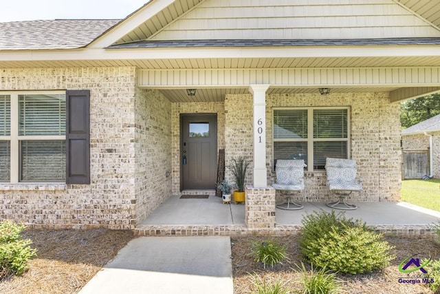 601 Hunts Landing Dr, Kathleen, GA 31047 - property entrance featuring a porch and brick siding