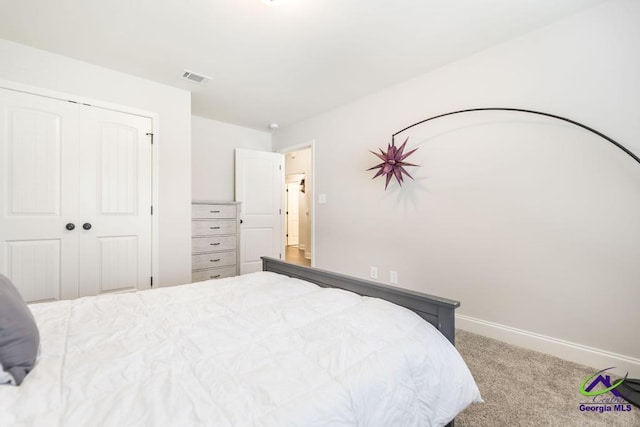 601 Hunts Landing Dr, Kathleen, GA 31047 - bedroom with carpet flooring, a closet, and baseboards