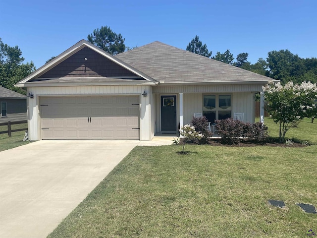 51 Cole Dr, Hawkinsville, GA 31036 - view of front of property featuring driveway, a garage, and covered porch