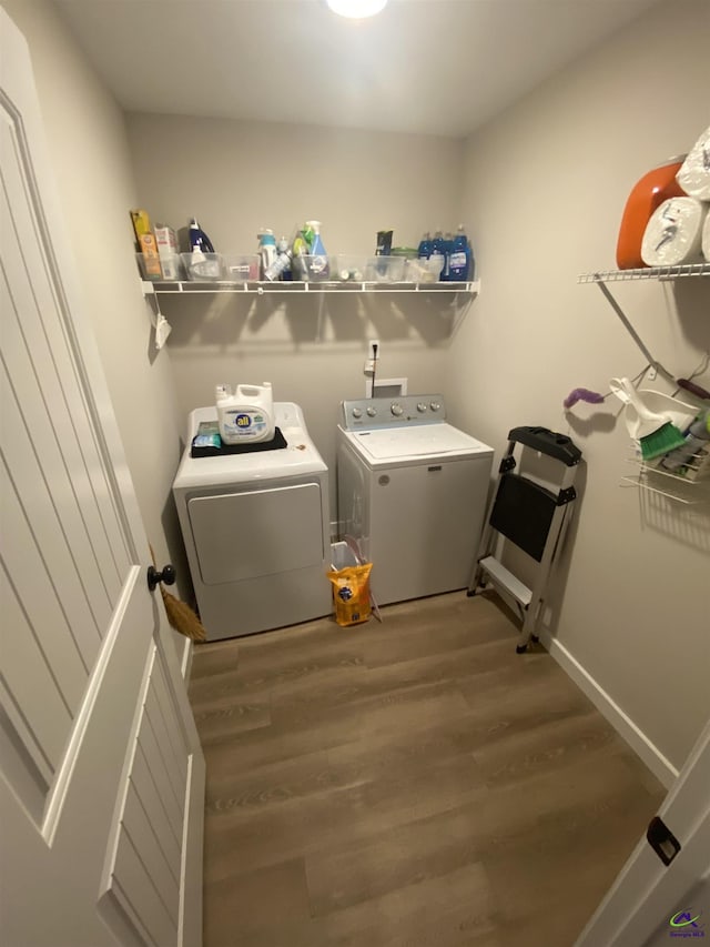 51 Cole Dr, Hawkinsville, GA 31036 - washroom featuring washer and clothes dryer and wood finished floors