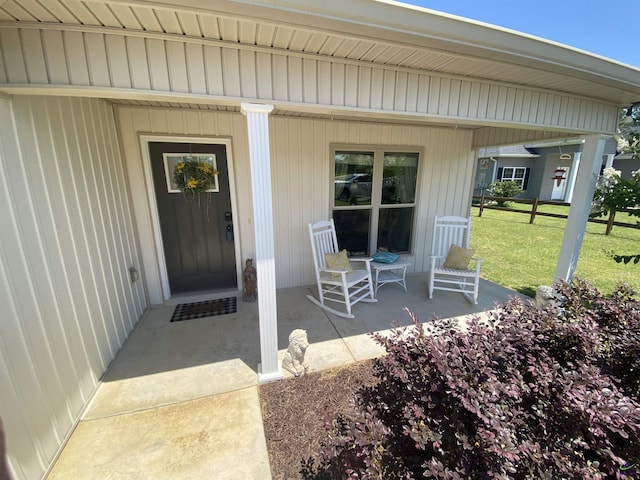 51 Cole Dr, Hawkinsville, GA 31036 - doorway to property with a lawn and covered porch