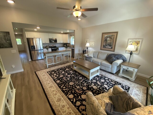 51 Cole Dr, Hawkinsville, GA 31036 - living room with plenty of natural light, baseboards, a ceiling fan, wood finished floors, and lofted ceiling