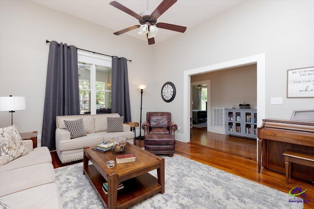 1360 Calhoun St, Macon, GA 31201 - living room with healthy amount of natural light, wood finished floors, and ceiling fan