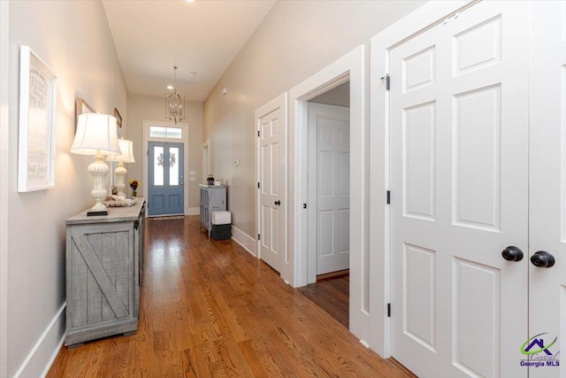 1360 Calhoun St, Macon, GA 31201 - foyer entrance featuring wood finished floors, baseboards, and a chandelier