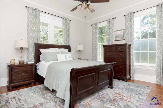 1360 Calhoun St, Macon, GA 31201 - bedroom with light wood-type flooring, baseboards, and ceiling fan