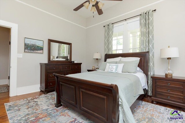 1360 Calhoun St, Macon, GA 31201 - bedroom with light wood-style flooring, baseboards, and ceiling fan