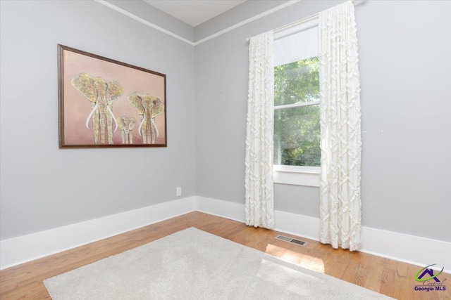 1360 Calhoun St, Macon, GA 31201 - unfurnished room with wood finished floors and baseboards
