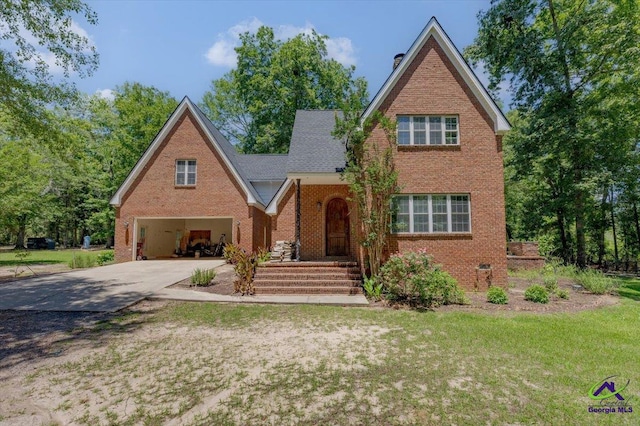 283 Limestone Rd, Cochran, GA 31014 - traditional-style house featuring brick siding, an attached garage, driveway, and a front lawn