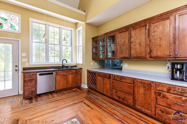 283 Limestone Rd, Cochran, GA 31014 - kitchen featuring dishwasher, a sink, and brown cabinetry