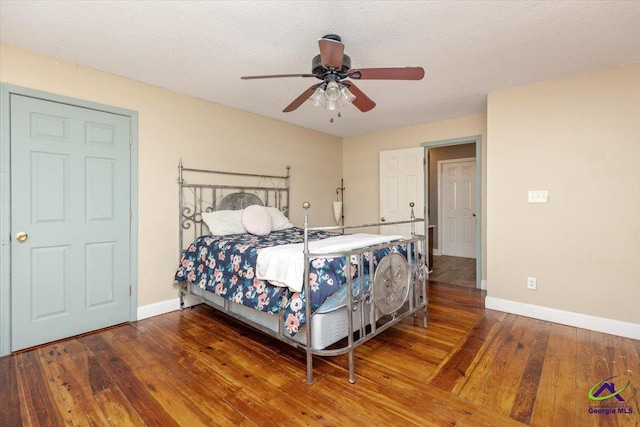 283 Limestone Rd, Cochran, GA 31014 - bedroom with hardwood / wood-style flooring, baseboards, and ceiling fan