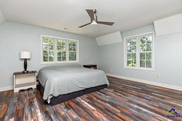 283 Limestone Rd, Cochran, GA 31014 - bedroom featuring wood finished floors, baseboards, lofted ceiling, a textured ceiling, and a ceiling fan