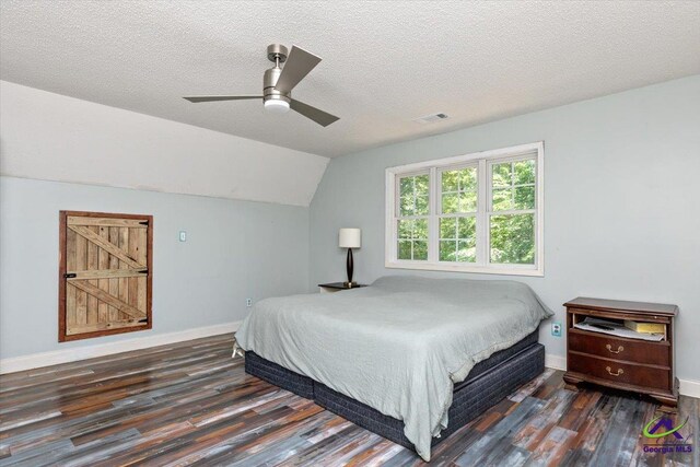 283 Limestone Rd, Cochran, GA 31014 - bedroom featuring wood finished floors, baseboards, vaulted ceiling, a textured ceiling, and a ceiling fan