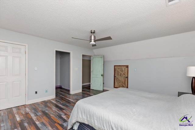 283 Limestone Rd, Cochran, GA 31014 - bedroom with wood finished floors, baseboards, a ceiling fan, and a textured ceiling