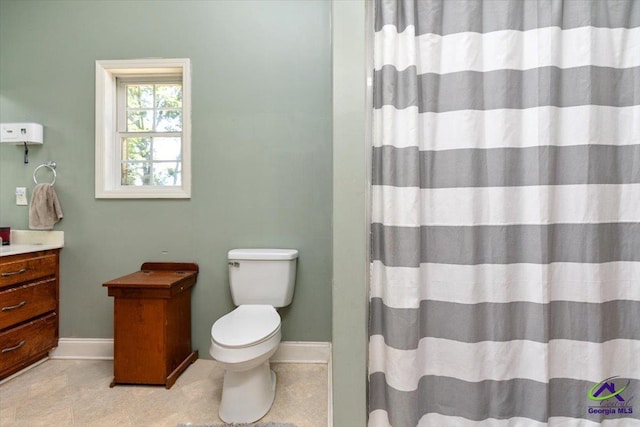 283 Limestone Rd, Cochran, GA 31014 - full bathroom featuring vanity, toilet, baseboards, curtained shower, and tile patterned floors