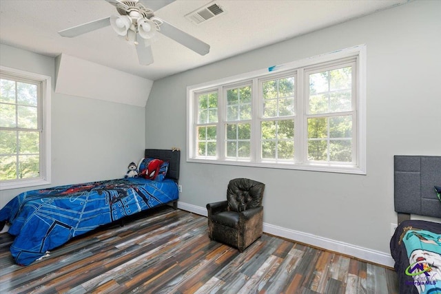 283 Limestone Rd, Cochran, GA 31014 - bedroom with wood finished floors, multiple windows, baseboards, ceiling fan, and lofted ceiling