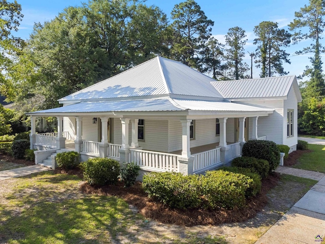 110 Minor Ave, Montezuma, GA 31063 - farmhouse featuring a porch and metal roof