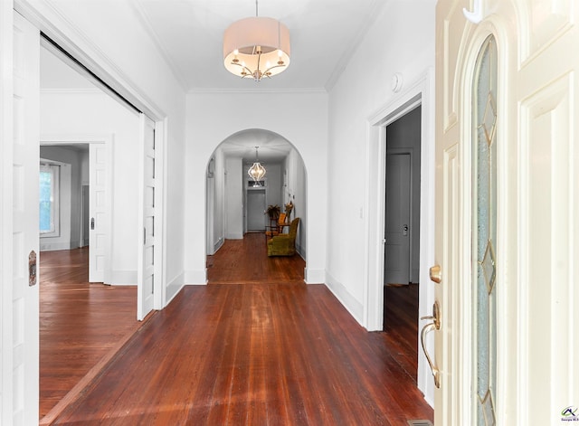 110 Minor Ave, Montezuma, GA 31063 - entrance foyer featuring arched walkways, dark wood-style floors, baseboards, and ornamental molding