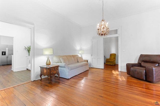110 Minor Ave, Montezuma, GA 31063 - living room featuring wood-type flooring, a chandelier, and ornamental molding