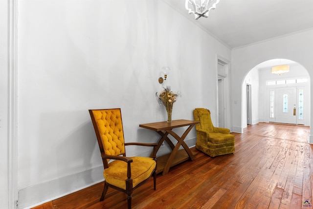 110 Minor Ave, Montezuma, GA 31063 - sitting room with arched walkways, dark wood-type flooring, a chandelier, and crown molding