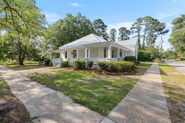 110 Minor Ave, Montezuma, GA 31063 - view of front of property featuring covered porch, a front yard, metal roof, and driveway