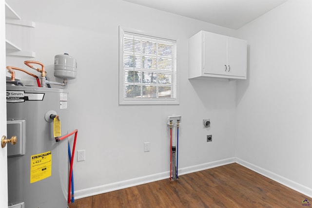 110 Minor Ave, Montezuma, GA 31063 - laundry area featuring water heater, cabinet space, dark wood-style flooring, hookup for a washing machine, and electric dryer hookup