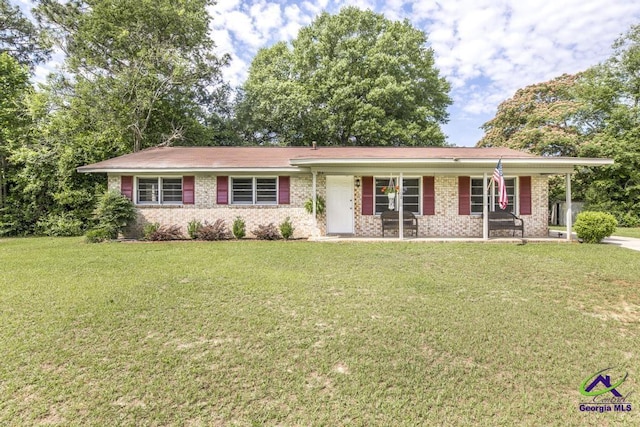 108 Marcia Ct, Warner Robins, GA 31088 - ranch-style house with a front yard, a porch, and brick siding