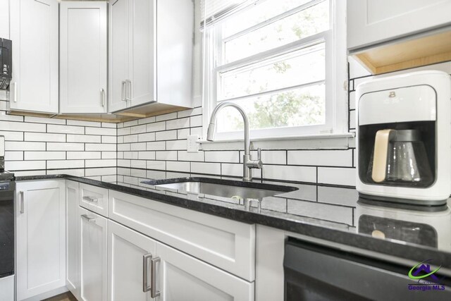 108 Marcia Ct, Warner Robins, GA 31088 - kitchen with a sink, tasteful backsplash, dark stone countertops, and black microwave