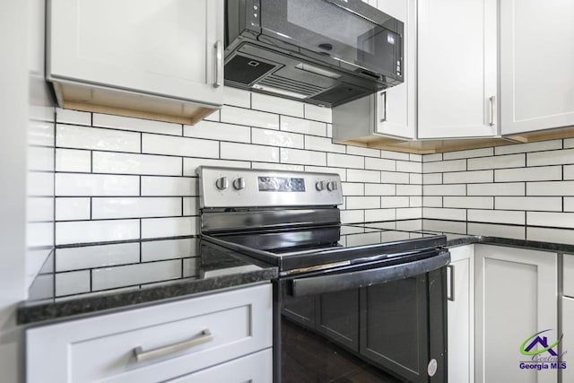 108 Marcia Ct, Warner Robins, GA 31088 - kitchen with electric range oven, black microwave, decorative backsplash, and white cabinetry