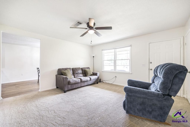 108 Marcia Ct, Warner Robins, GA 31088 - carpeted living room with ceiling fan and baseboards