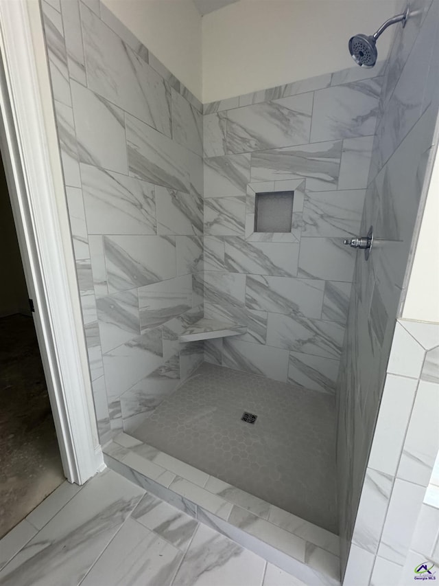 502 Otters Ridge Dr, Kathleen, GA 31047 - bathroom with marble look tiles and tiled shower