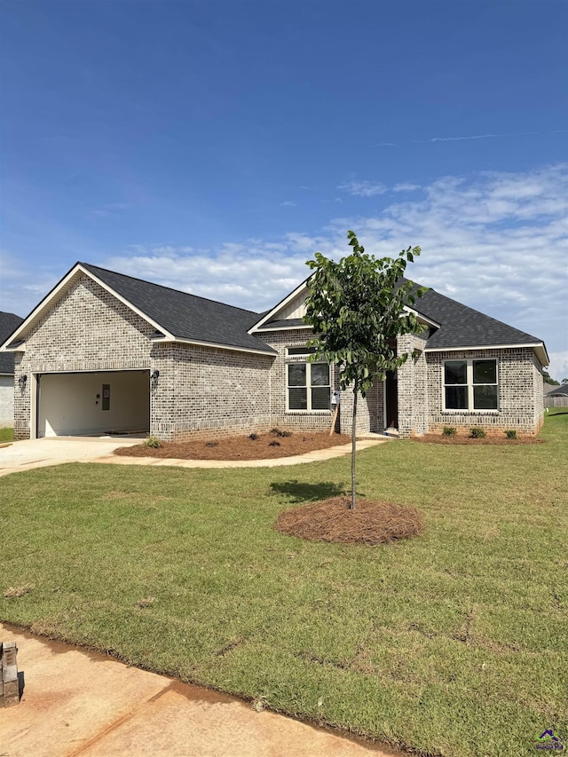 502 Otters Ridge Dr, Kathleen, GA 31047 - single story home with brick siding, an attached garage, driveway, and a front yard